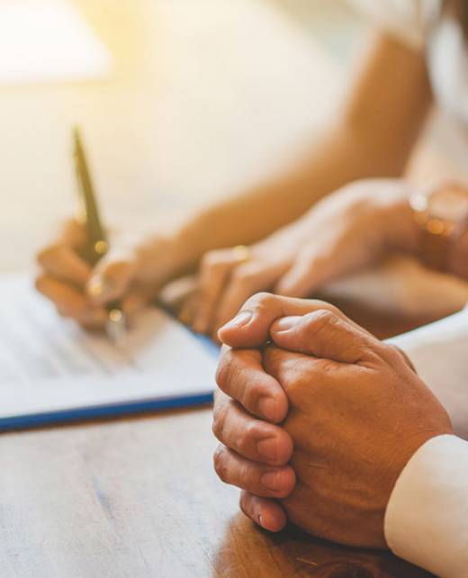 Salespeople are explaining the deal to customers to sign the contract.