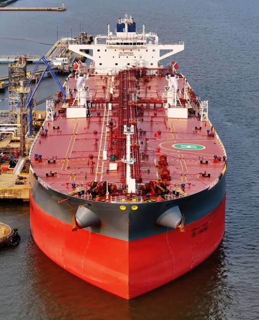 Aerial Close-up View of Oil Tanker Ship in Port at Refinery